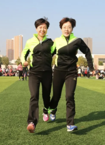 two-people-on-three-legged